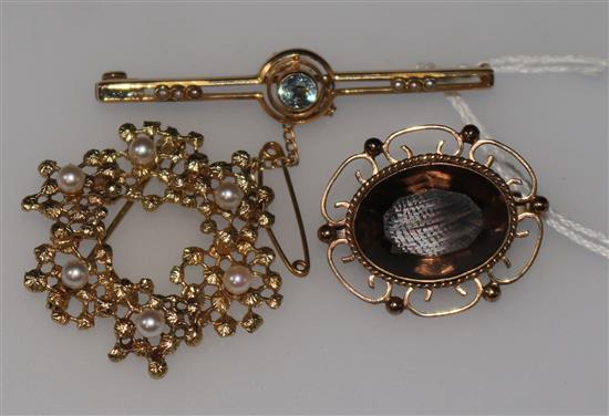 A 15ct gold and gem set bar brooch and two 9ct brooches.